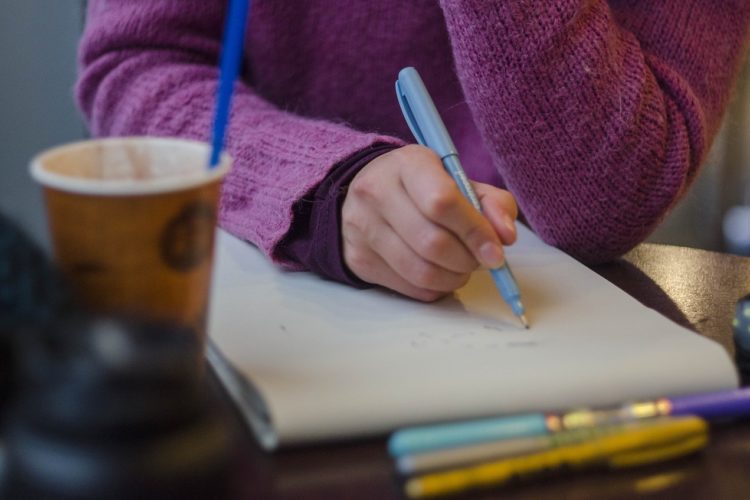 Woman drawing a design